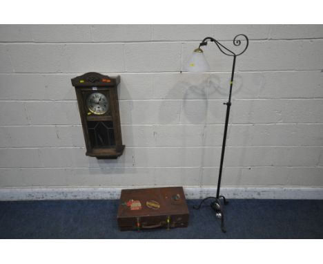 A WROUGHT IRON TELESCOPIC STANDARD LAMP, a 20th century oak clock and a leather case (condition report: clock with two windin