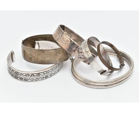 SIX BRACELETS, to include a silver cuff bangle with Aztec pattern, hallmarked London, a silver hinged bangle with floral patt