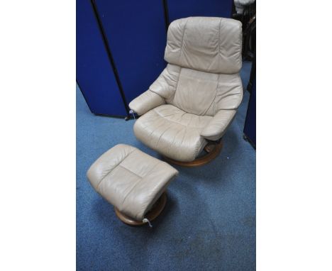 AN EKORNES STRESSLESS CARAMEL LEATHER UPHOLSTERED RECLINING ARMCHAIR, along with a footstool (condition report: general signs