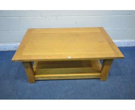 A LIGHT OAK RECTANGULAR COFFEE TABLE, raised on block legs, united by an undershelf, width 120cm x depth 76cm x height 47cm (