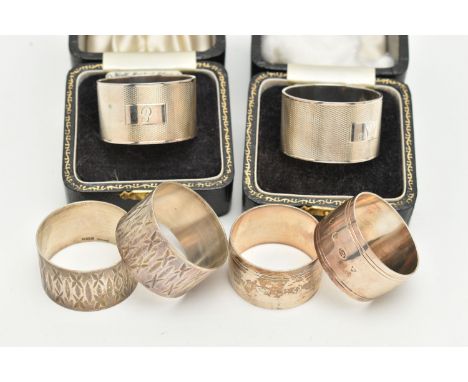 THREE SETS OF SILVER NAPKIN RINGS, to include two boxed engine turned pattern rings, engraved initials to the cartouches, eac