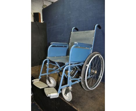 A VINTAGE VESSA WHEELCHAIR with two footrests