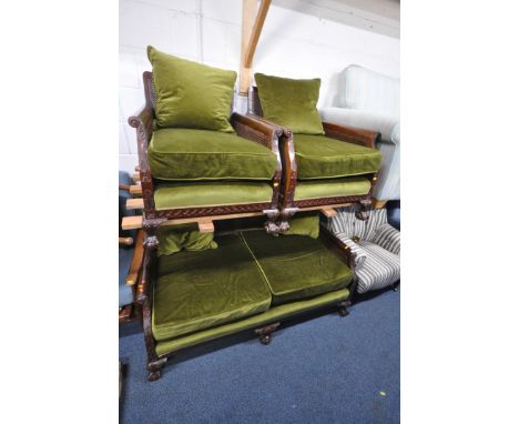 AN EARLY 20TH CENTURY MAHOGANY THREE PIECE LOUNGE SUITE, comprising a two seater sofa, with green upholstery, cane back rest 