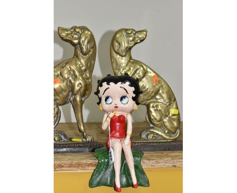 A CAST IRON FIGURE OF BETTY BOOP AND A PAIR OF BRASS SPANIEL DOORSTOPS, the painted shelf sitting Betty Boop figure holding a