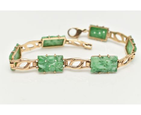 A 9CT GOLD JADE PANEL BRACELET, the rectangular jade panels carved to depict fruits and foliage, connected with interlocking 