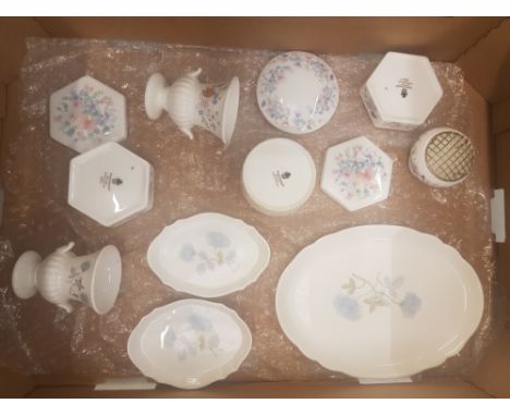 A collection of Wedgwood ceramic items to include dressing table type pin trays and dishes, small urns, lidded powder pots et