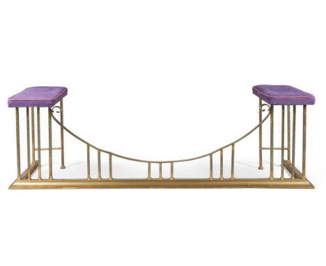 A BRASS CLUB FENDER MID-20TH CENTURY  With padded ends and a bowed centre with rope-twist uprights  59cm high, 190cm wide, 49