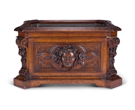 THE ADLINGTON HALL OAK WINE-COOLER A VICTORIAN OAK RECTANGULAR WINE-COOLER MID-19TH CENTURY  With a moulded rim, the front pa