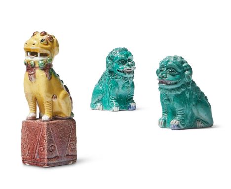 A SMALL PAIR OF CHINESE GREEN-GLAZED BUDDHIST LIONS AND A FAMILLE VERTE BUDDHIST LION 19TH CENTURY seated with mouths open sh