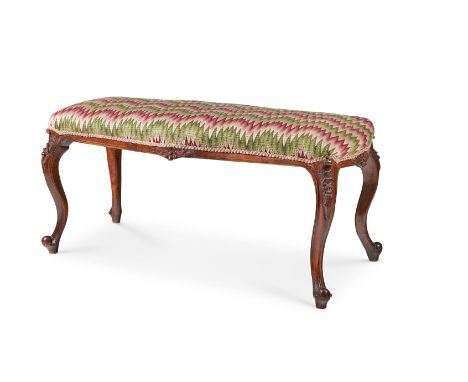 A VICTORIAN WALNUT LONG STOOL MID-19TH CENTURY With a padded serpentine seat with bargello tapestry cover by Patricia Rawling