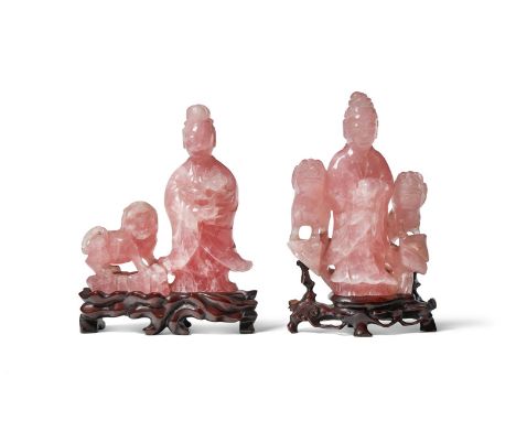 TWO CHINESE ROSE QUARTZ GROUPS OF GUANYIN AND BUDDHIST LIONS LATE 19TH CENTURY each standing holding flowers 20cm and 22cm hi