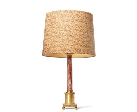 A GILT METAL MOUNTED STONE COLUMNAR TABLE LAMP  20TH CENTURY Paper shade, variegated rouge marble effect stem, fitted for ele