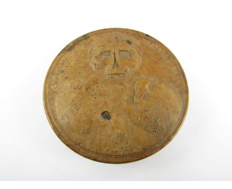 A late 18th / early 19th Century pressed maple drum-form snuff box, the cover depicting in relief three phrenology skulls wit