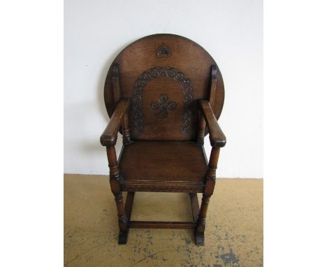 A 1930s carved oak monks' single seat bench / table