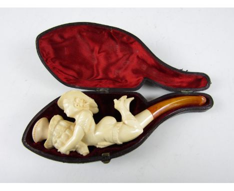 A late 19th Century risqué meerschaum cigarette or cheroot pipe, the bowl modelled a bathing beauty in swimming costume, boot