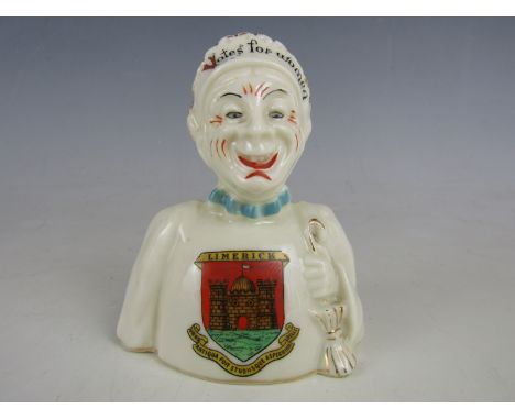 An early 20th Century Arcadian China Suffragist crested ware two-faced figurine, one side in depiction of an old lady bearing