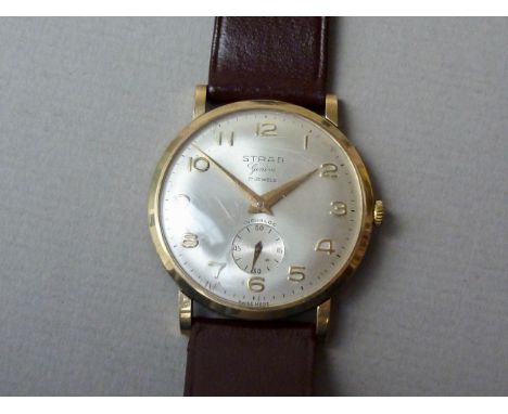 A 1960s Strad 9ct gold cased wrist watch, having a 17 jewel manual wind movement with radially-brushed silver face, the latte