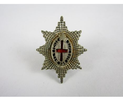 A Coldstream Guards officers' silver and enamel badge, JRG, Birmingham, 1959, 36 mm high