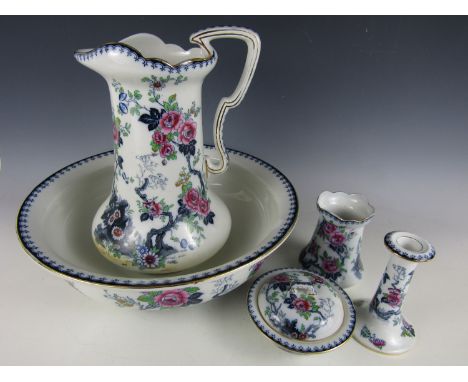 An early 20th Century Losol Ware porcelain wash set, comprising jug and basin, toothbrush holder, soap dish and candlestick
