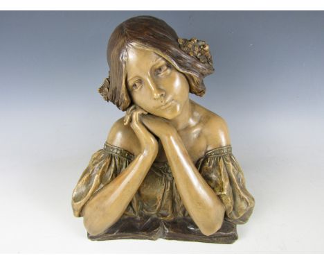 A Goldscheider style Art Nouveau painted terracotta bust of a young woman after Doebrich, depicted in Renaissance revival dre