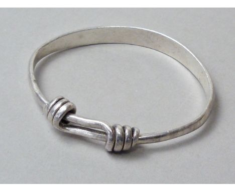 A vintage Chinese white metal bangle, with engraved character marks, tests as silver, 32.9g