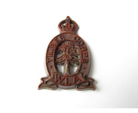 A Second World War Timber Corps Women's Land Army plastic cap badge (one tab lacking)