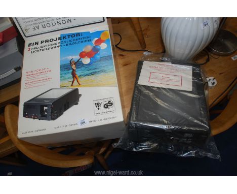 A boxed EIN projector, made in West Germany "new".