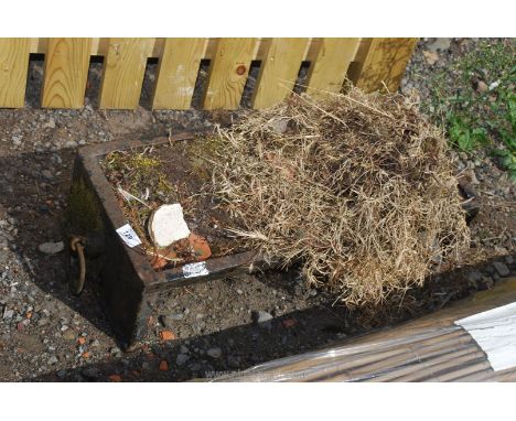 A cast iron pig trough, 2' long x 10 1/2".