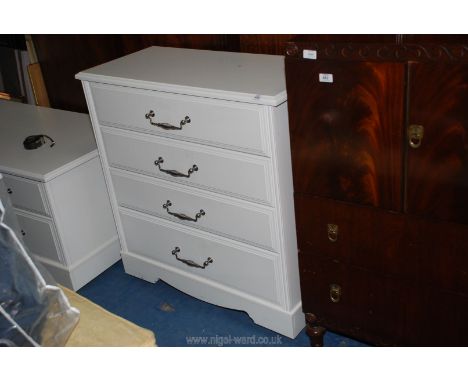 A white four drawer chest of drawers 34" wide x 16 deep x 3' high. 