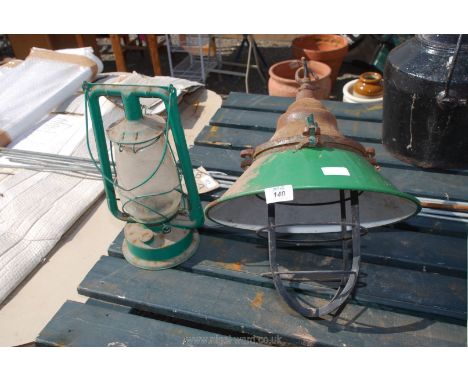 A tilly lamp and an enamel lamp. 