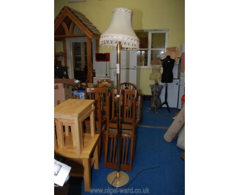 A brass standard lamp and shade. 
