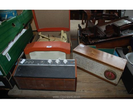 A record player, amp and a sky baron radio.