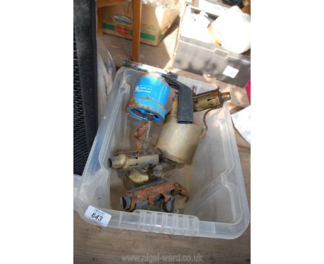 A box of three brass blow lamps and a small Calor blow lamp.