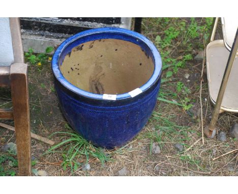 A blue glazed planter, 13" high x 13 1/2" diameter.