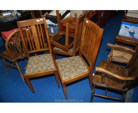 Four dining chairs with tapestry drop-in seats.