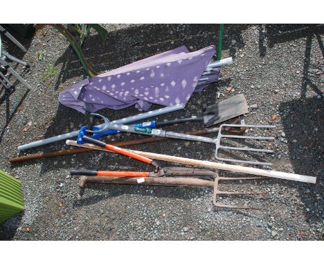 Miscellaneous garden tools, 2 forks, umbrella, clippers and spade.