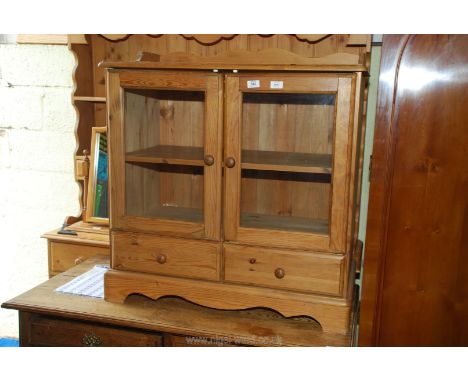 A glass fronted display cabinet with shelf and two drawers, 34 1/2" wide x 7 1/2" deep x 33 1/2" high.