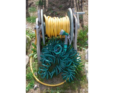 A Hose on reel with sprayer head.