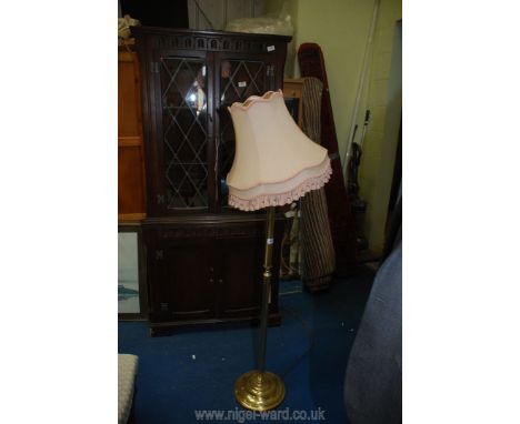 Standard lamp with shade.