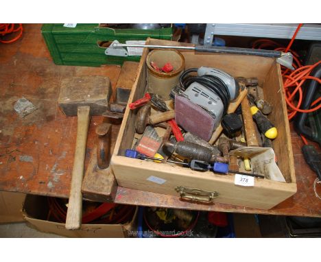 Hand tools and hand sander.