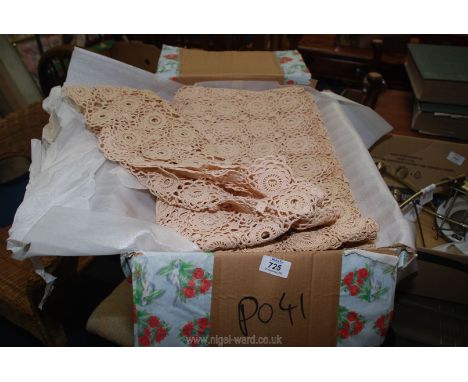 A very large tablecloth made by machine in cream.