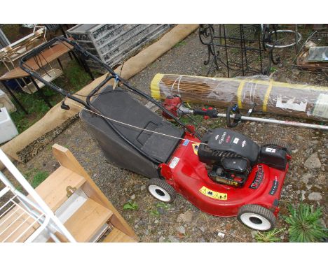 A Champion self propelled 20" cut mower, Briggs &amp; Stratton engine (engine turns).