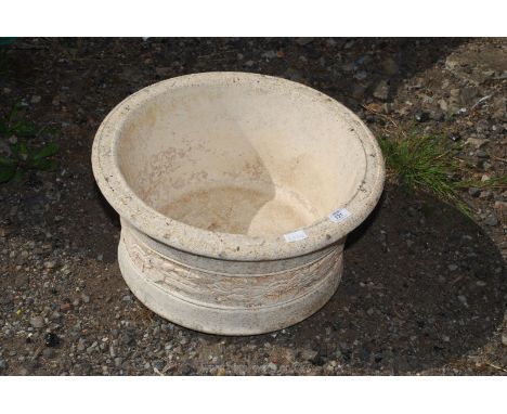 A concrete planter, 20" wide x 10" high.