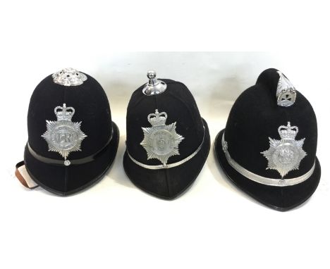 A collection of three Welsh Policemans helmets: One North Wales Constabulary and two South Wales Constabulary. One with Rose 
