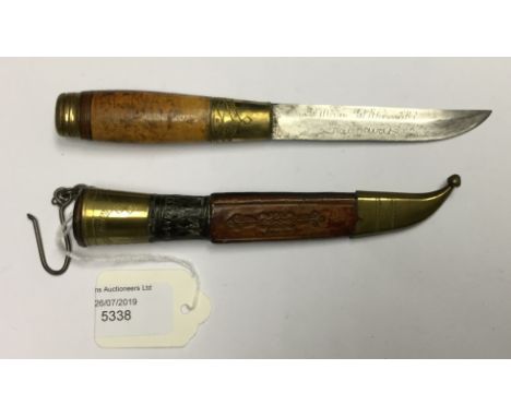 Finnish Puukko knife with single edged 95mm long blade inscribed with owners name in Finnish. Brass bolster and pommel with w