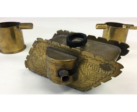 WW1 British Trench Art Ink Well in the form of a WW1 Tank. Made of brass and inscribed "1914-1919" along with "Arras" &amp; "