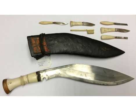 Private purchase Nepalese Kukri knife with 31.5 cm blade. No markings. Ivory and wooden grip. Overall length 43cm. Complete w