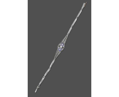 An Art Deco Sapphire and Diamond Bracelet, an old cut diamond in a white millegrain setting set centrally in an 'infinity' sy