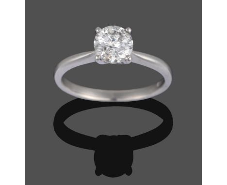 A Platinum Diamond Solitaire Ring, the round brilliant cut diamond in a four-claw setting, to a plain polished shank, estimat