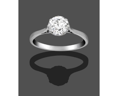 A Diamond Solitaire Ring, the old cut diamond in a white claw setting on a tapered shoulder plain polished shank, estimated d